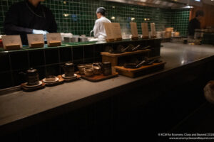 a counter with dishes and utensils in a kitchen