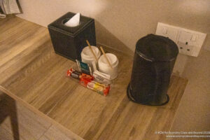 a group of candy and a black trash can
