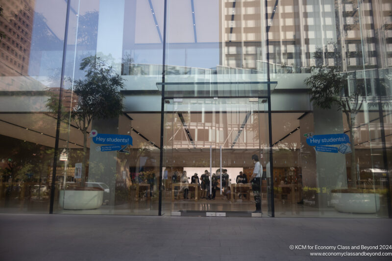 Glass door of a building with people