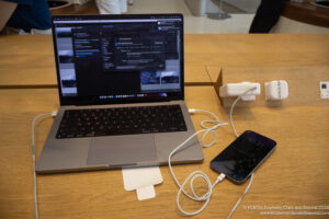 a laptop and phone on a table