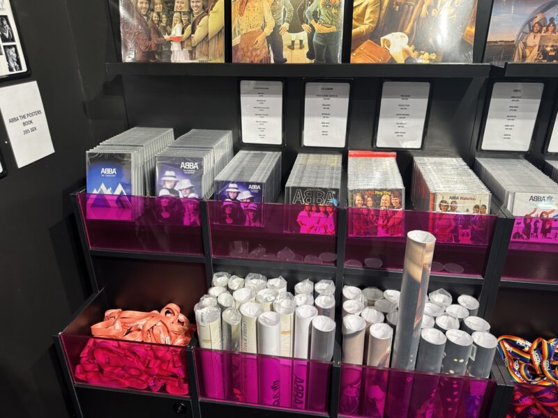 a shelf with several pictures of people and a group of papers