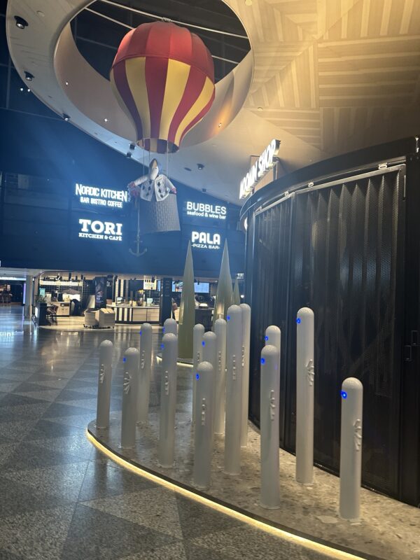 a large room with a hot air balloon and a large sign