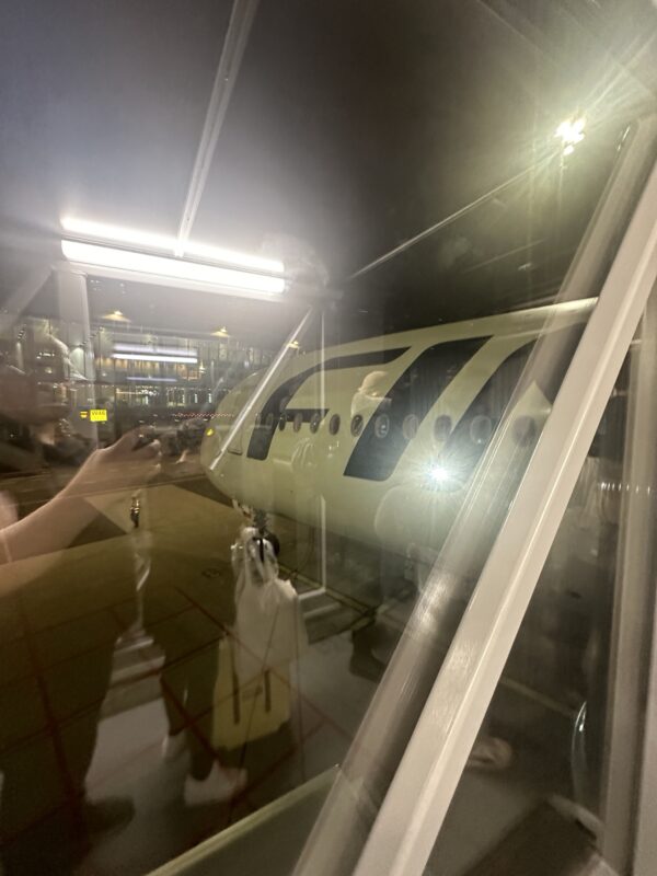 a window with a plane in it