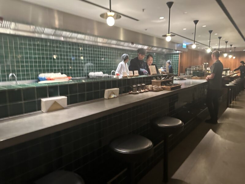 a group of people standing at a counter