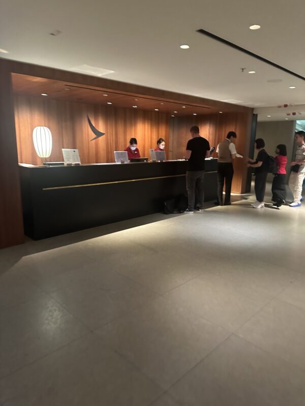 people standing in front of a reception desk