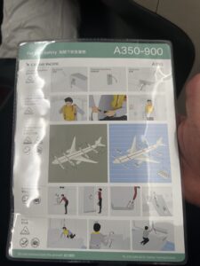 a hand holding a package with instructions