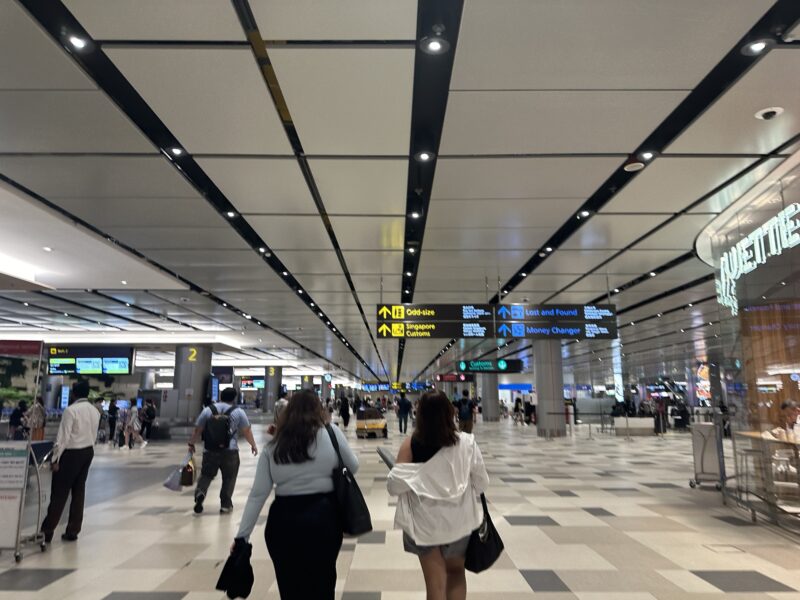 people walking in a large airport