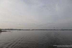 a body of water with buildings in the distance