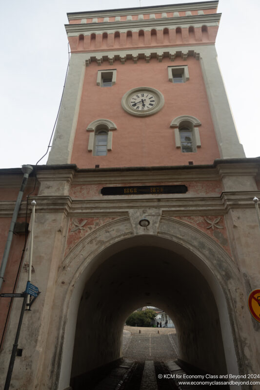 a clock tower with a tunnel