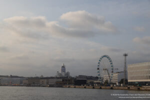 a ferris wheel next to a body of water