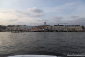 a body of water with buildings in the background