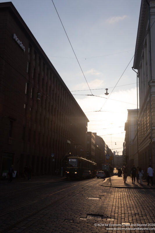 a street with buildings and a trolley on it