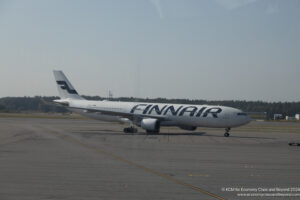 a large white airplane on a runway