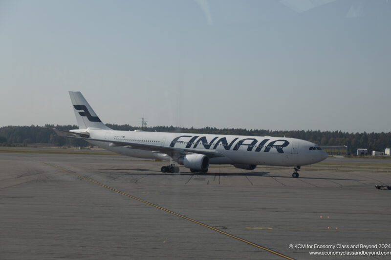 a large white airplane on a runway