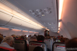a group of people sitting in an airplane