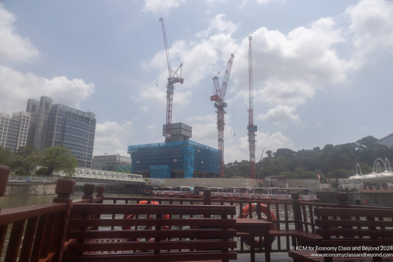 a group of cranes in front of a building