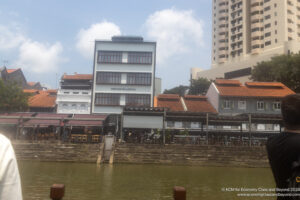 a building next to a body of water