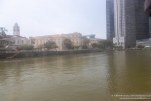 a body of water with buildings in the background