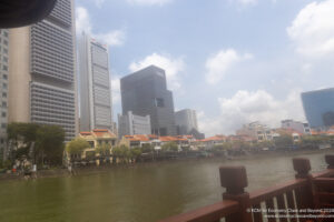 a body of water with buildings in the background