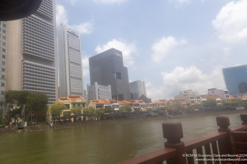 a body of water with buildings in the background