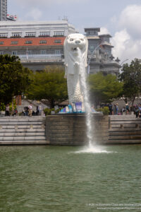 a statue of a lion with a body of water pouring out of it