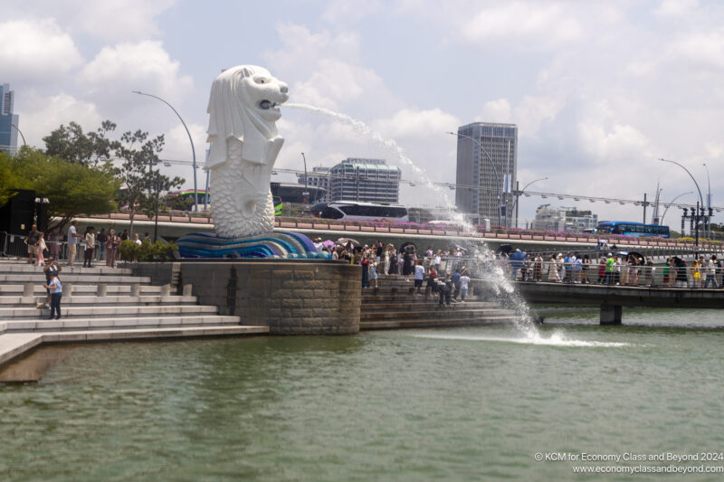 a statue of a lion spraying water from a fountain