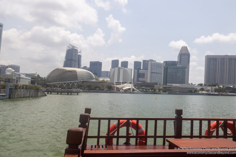 a body of water with a city in the background