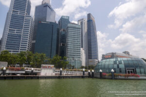 a body of water with buildings in the background