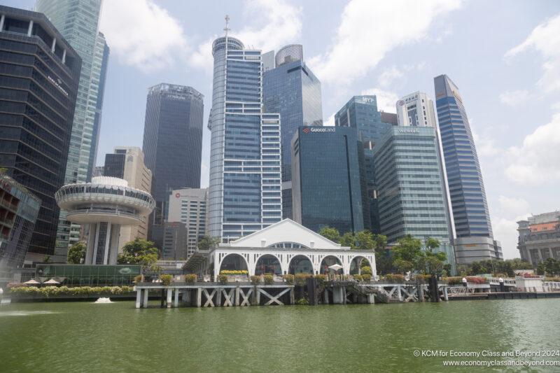 a city skyline with a body of water