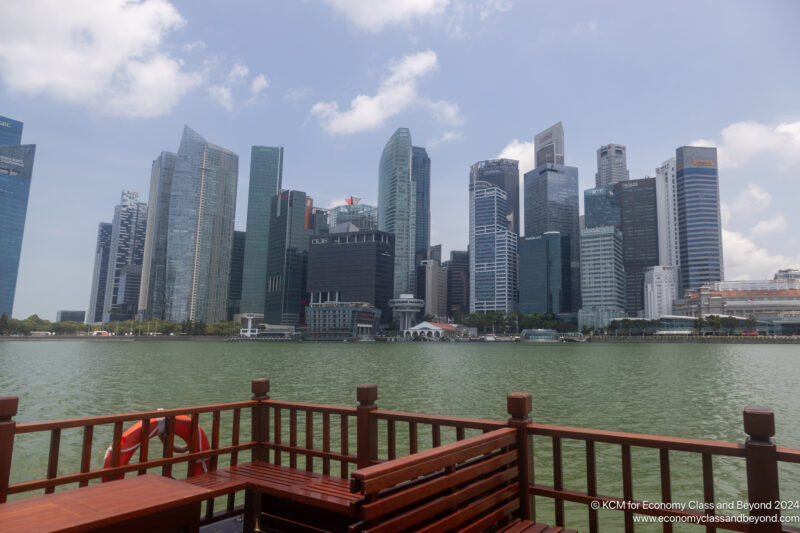 a city skyline with a body of water