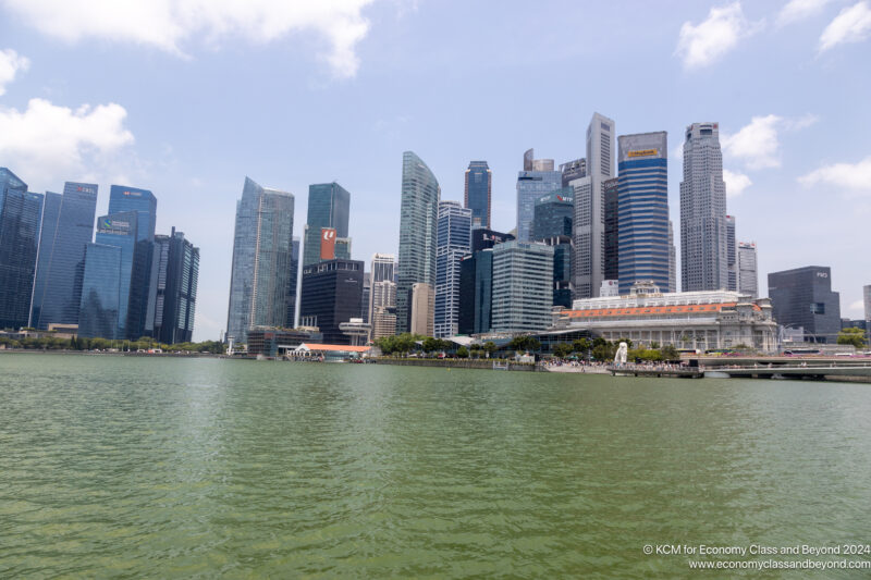 a city skyline with a body of water