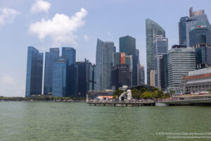 a city skyline with a body of water and a body of water