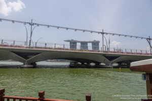a bridge over water with cars on it