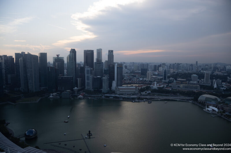 a city with tall buildings and a body of water