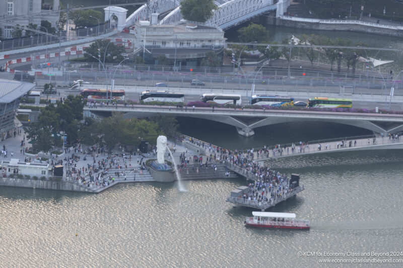 a group of people walking on a bridge