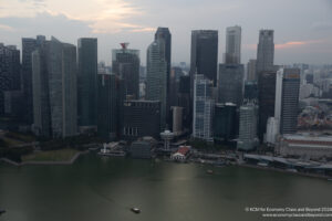 a city skyline with a body of water
