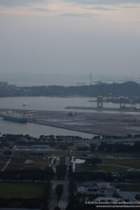 a large port with cars and a large body of water