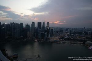 a city skyline with a body of water