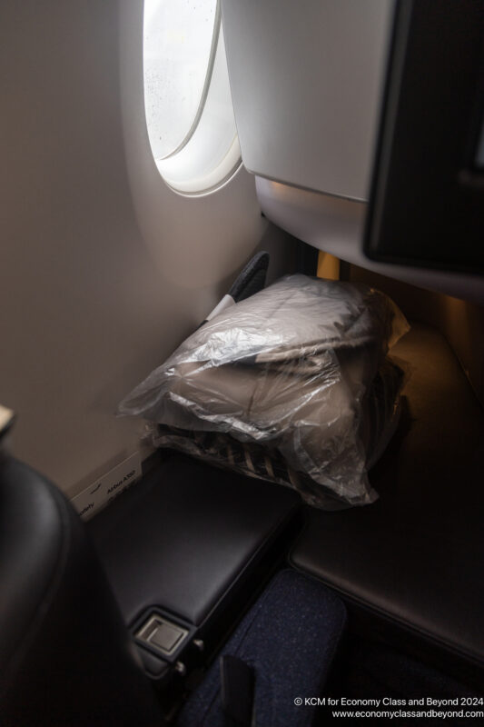 a plastic bag on the side of a plane