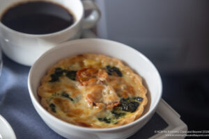 a bowl of food and a cup of coffee