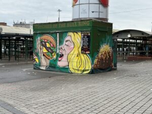 a green building with graffiti on it