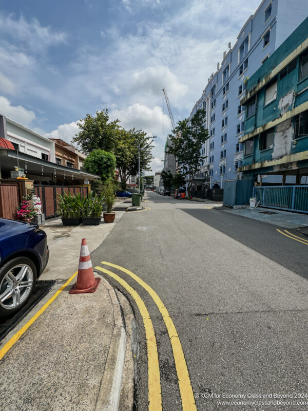 a street with cars and buildings