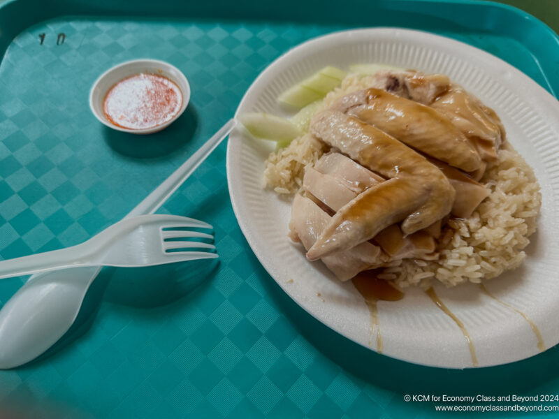 a plate of food with a spoon and fork