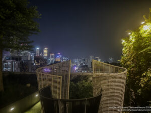 a chair on a rooftop overlooking a city