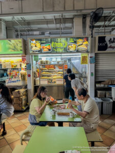 people sitting at a table eating food