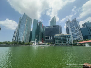 a city with tall buildings and a body of water