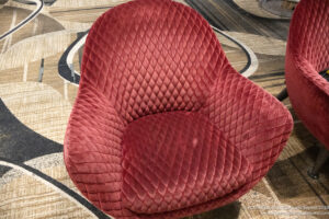 a red chair on a carpet