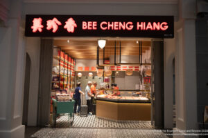 a store front with people standing in front of it