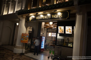 a man standing in front of a restaurant