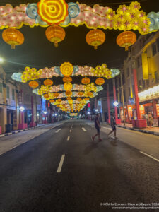 a street with lanterns over it